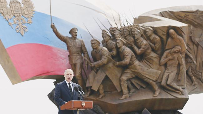 Russian President Vladimir Putin delivers a speech at the opening ceremony of the Poklonnaya Hill monument in Moscow, August 1, 2014.